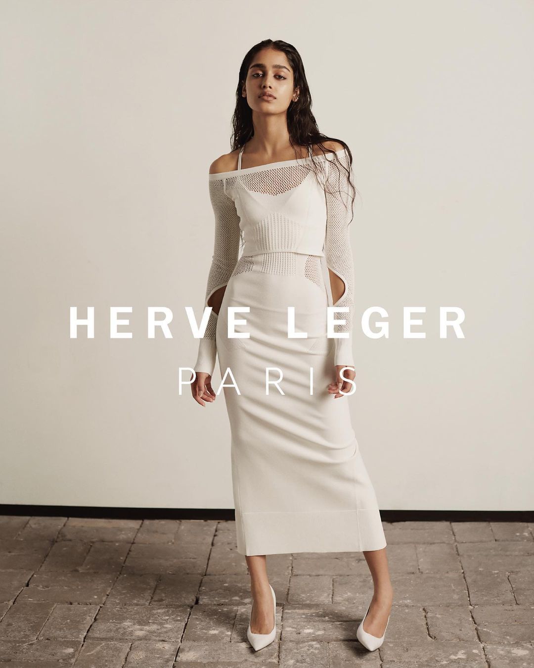 Fashion shoot featuring a woman in a knit dress and heels, posing against a light background with 'Herve Leger Paris' text overlay.