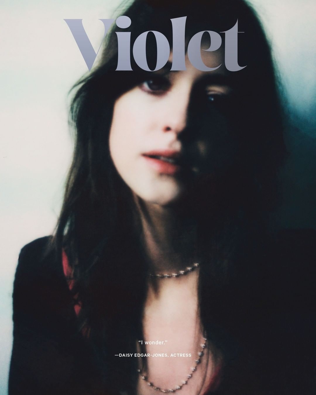 Close-up magazine cover shot of Daisy Edgar-Jones with muted color palette, pearl necklace, and "Violet" text overlay.