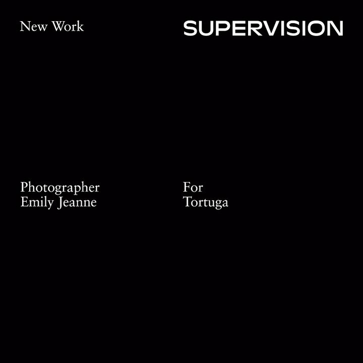 Abstract black image with text: 'New Work,' 'SUPERVISION,' 'Photographer Emily Jeanne,' and 'For Tortuga' visible on a dark background.