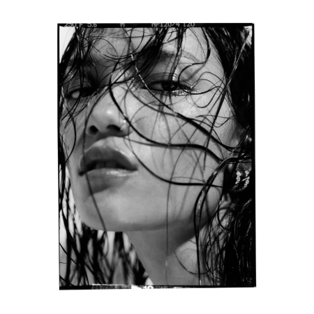 Close-up monochrome portrait of a model with wet hair clinging to her face captured by Rory Payne