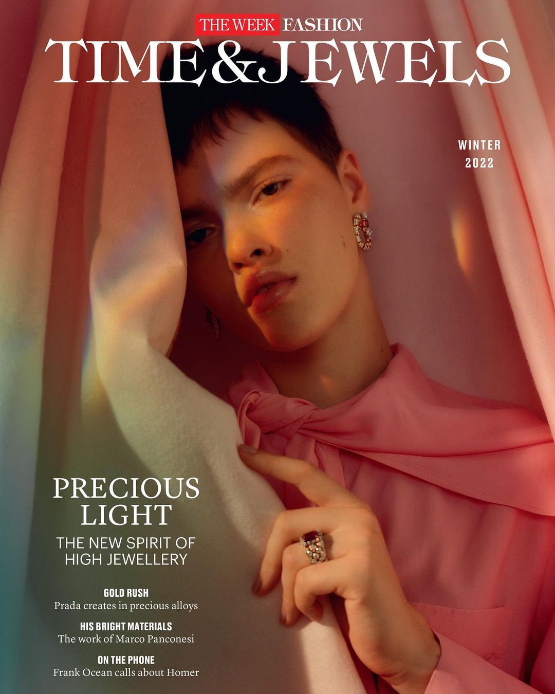 Magazine cover featuring a person with jewelry, pink top, and drapes. The title is Time & Jewels, Winter 2022 issue from The Week Fashion.