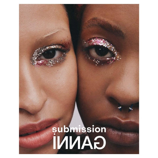 Two women with glitter makeup pose closely together in a beauty shot, showing their faces and makeup details in a minimalist studio setting.