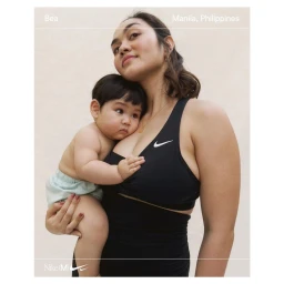 Woman holding a toddler while wearing a black athletic top against a neutral background with overlaid text.
