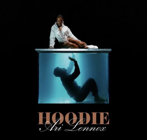 Music album cover featuring Ari Lennox seated atop an illuminated glass tank containing a silhouetted person underwater, against a black backdrop.