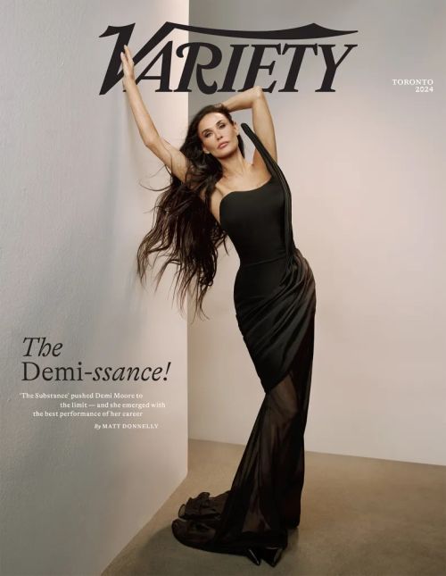 Demi Moore poses on the cover of Variety in a long black dress with long flowing hair, set against a neutral background.