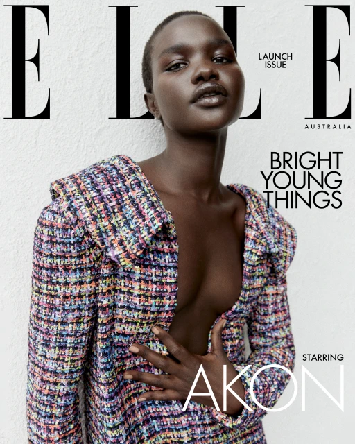Elle Australia cover featuring a Black woman with short hair wearing a multicoloured tweed jacket against a textured white wall.