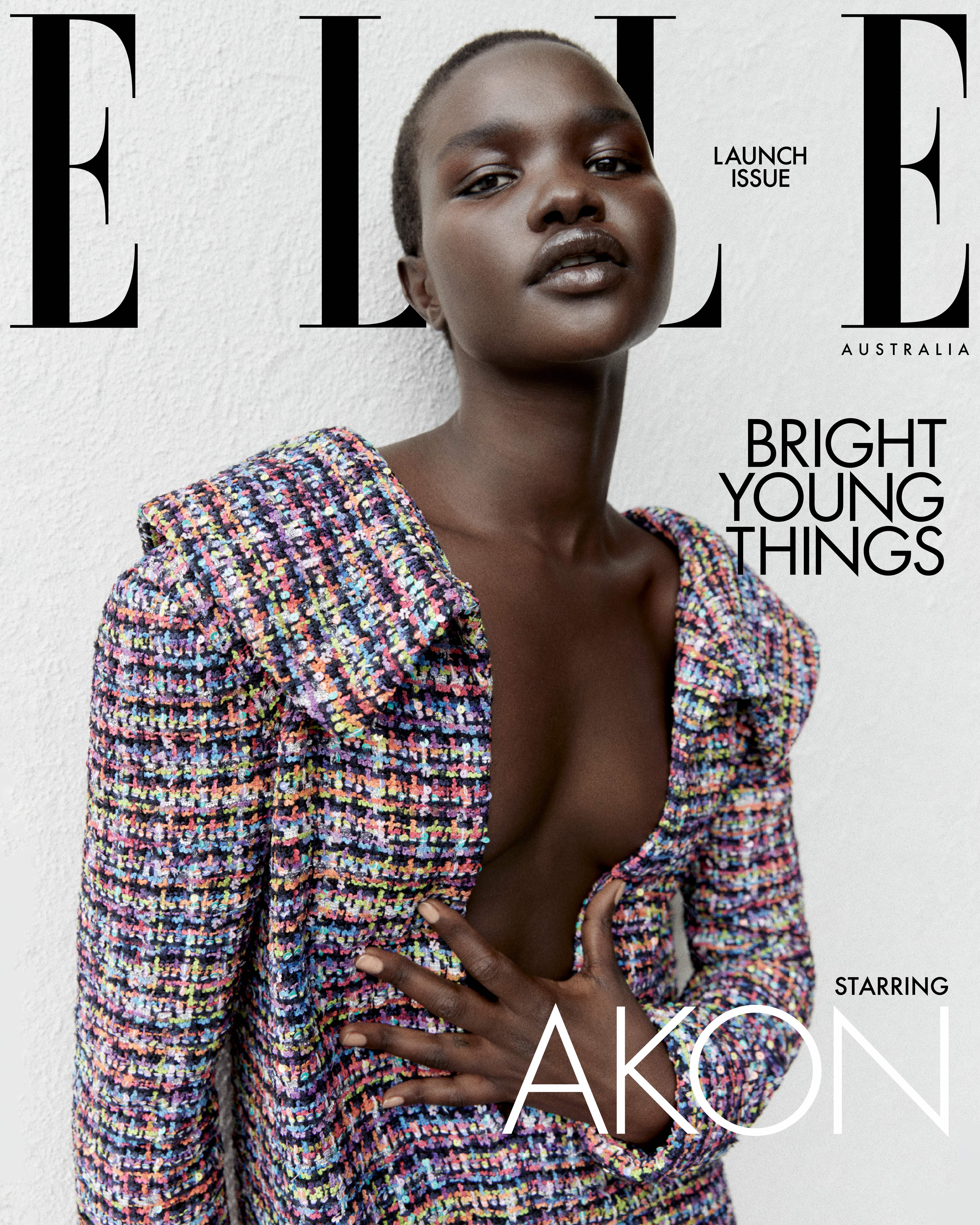 Elle Australia magazine cover featuring model Akon Changkou wearing a tweed blazer against a textured white wall backdrop.