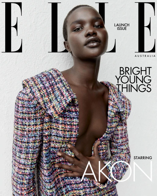 Elle Australia magazine cover featuring model Akon Changkou wearing a tweed blazer against a textured white wall backdrop.