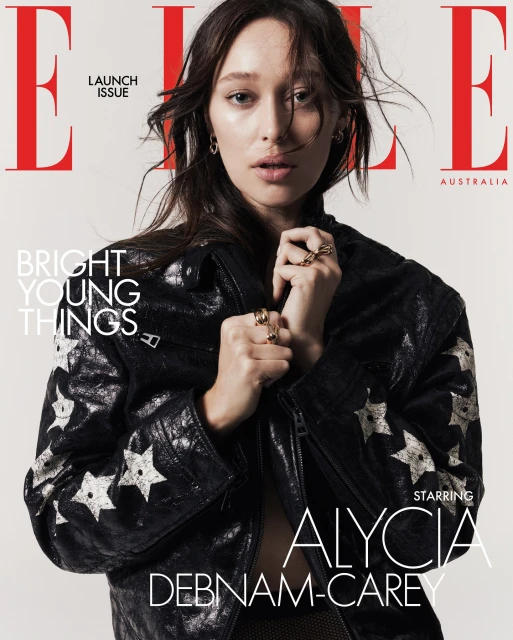 Close-up magazine cover featuring Alycia Debnam-Carey wearing a star-studded black jacket with red 'ELLE' masthead against white.
