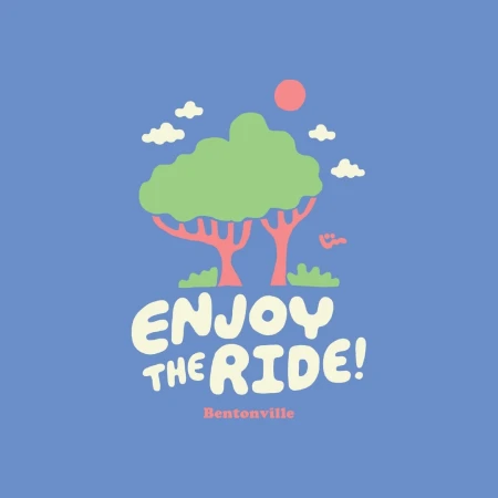 Whimsical illustration featuring cartoon trees, clouds, and sun, along with stylized text "Enjoy the Ride!" and the location "Bentonville."