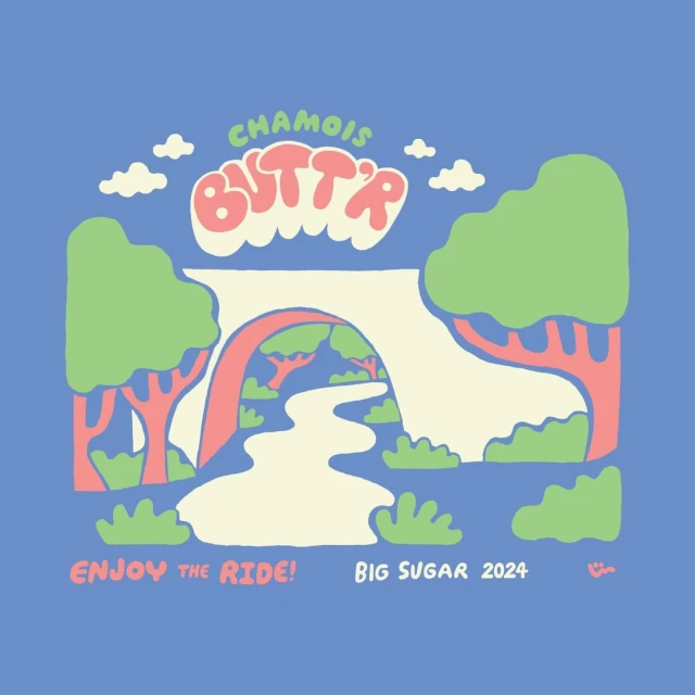 Illustrated landscape features a white bridge over a river, trees, and the text 'Chamois Butt'r' with 'Enjoy the Ride! Big Sugar 2024'.