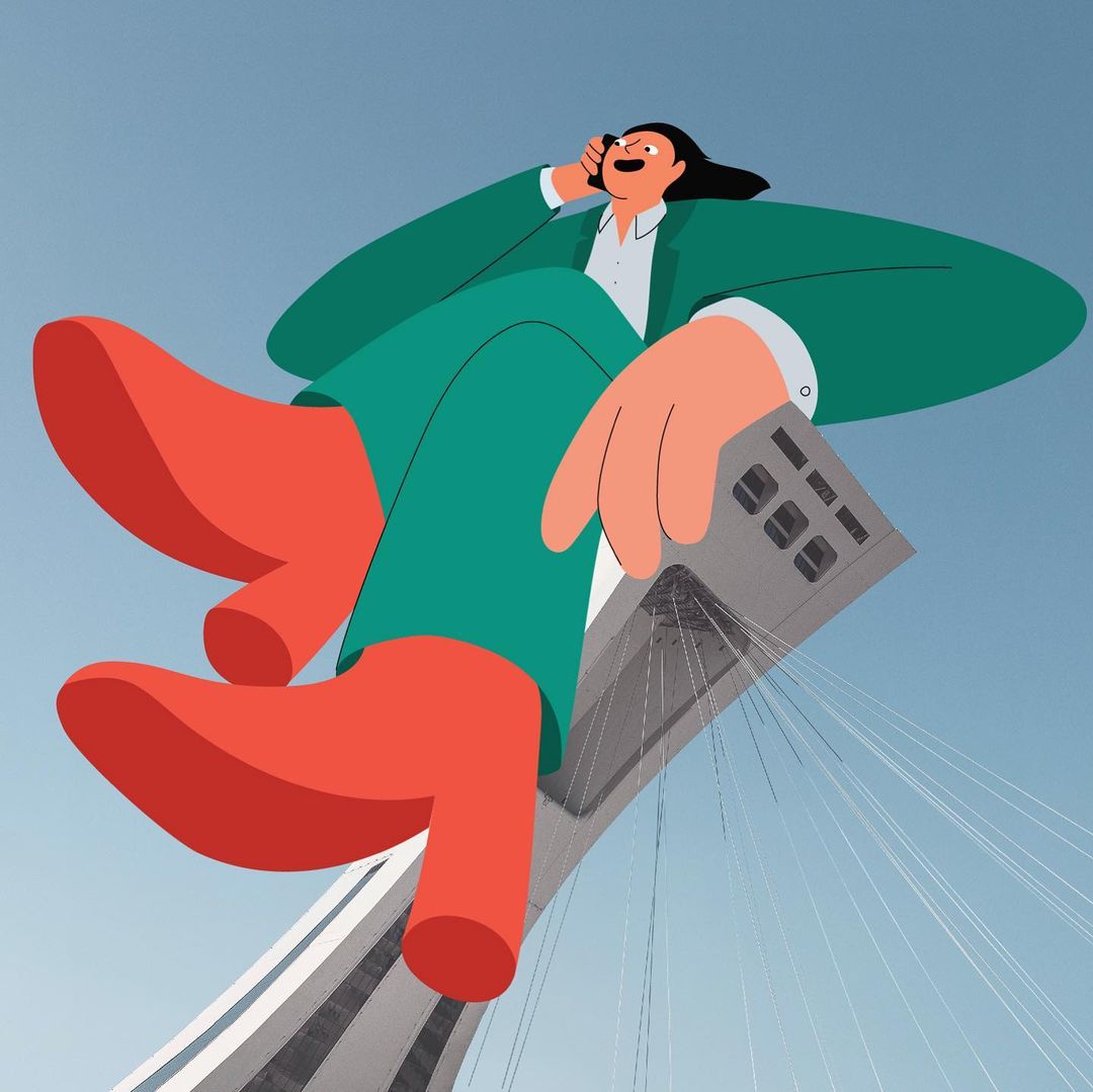 Cartoon illustration: Person in green suit and red boots talks on cell phone, holding a gray laptop against a blue sky and building.