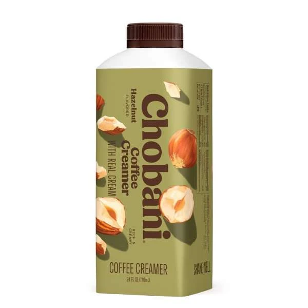 Chobani Hazelnut coffee creamer in a carton, showcased against a white background, with hazelnut images and a brown cap.