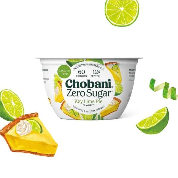 Chobani Zero Sugar Key Lime Pie yogurt cup with key lime pie slice, key lime wedges, and a swirl of key lime peel.