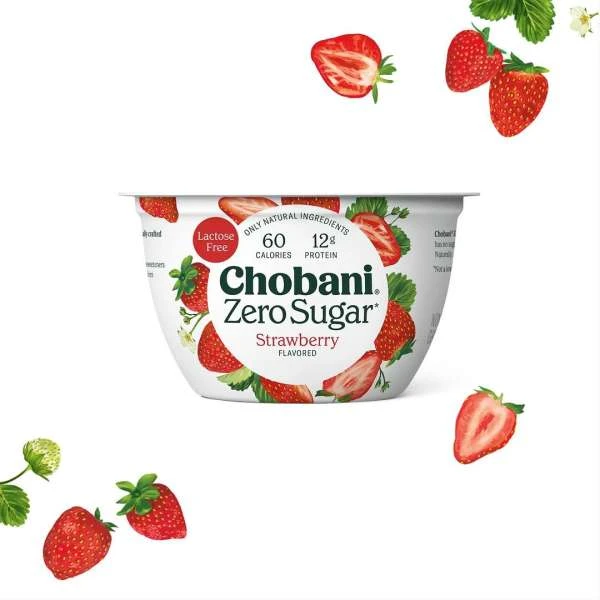 Chobani Zero Sugar Strawberry yogurt in a white container with scattered strawberries, set against a clean white background.