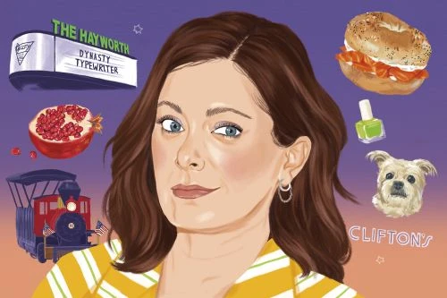 Illustration of a woman in a striped yellow jacket surrounded by a train, sandwich, pomegranate, dog, and nail polish on purple.