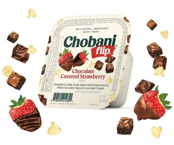 Chobani Flip Chocolate Covered Strawberry yogurt container surrounded by brownies and chocolate-covered strawberries on a white backdrop.
