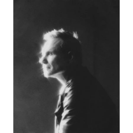 Monochrome profile portrait of a man with dramatic backlighting and a glowing halo effect by Erik Tanner