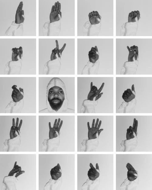 Montage of a person wearing a white hooded jumpsuit and making various hand gestures in front of a white background in a grid.
