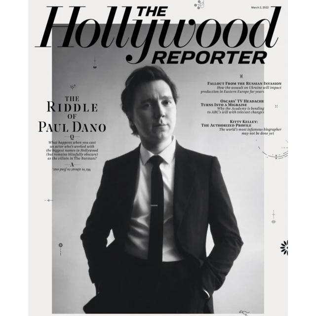 Paul Dano on the cover of The Hollywood Reporter, in a black and white portrait, wearing a suit and tie. Magazine cover.