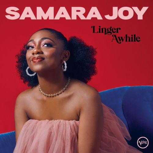 Portrait of Samara Joy against a red background wearing a pink tulle dress and jewelry, promoting her album Linger Awhile.