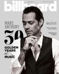 Monochrome magazine cover portrait of Marc Anthony wearing a vest and white shirt, photographed by Alan Silfen.