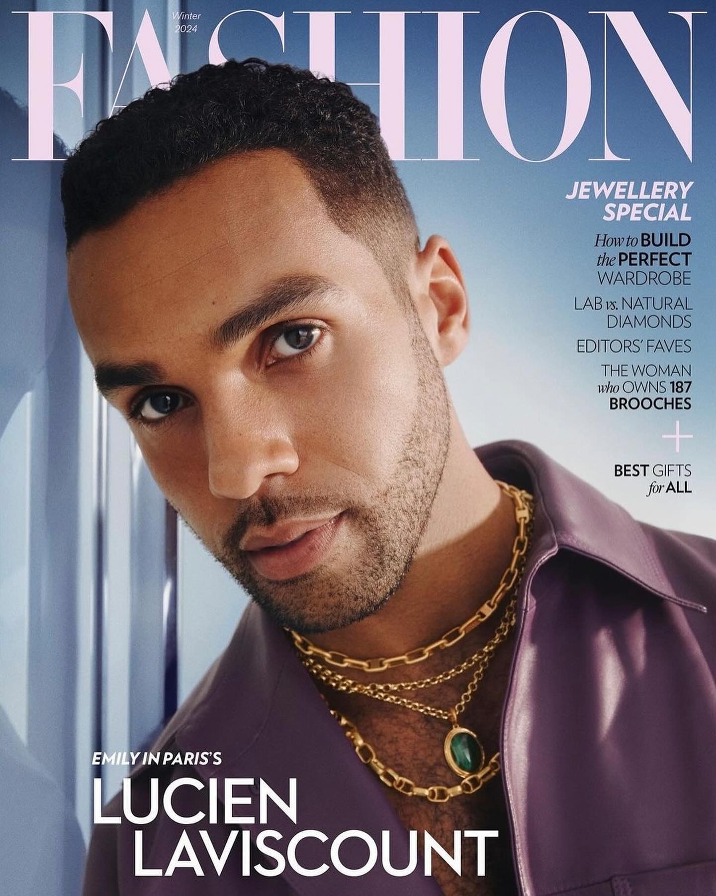 Fashion magazine cover featuring Lucien Laviscount in a purple jacket and gold chains against a gradient blue and white background.