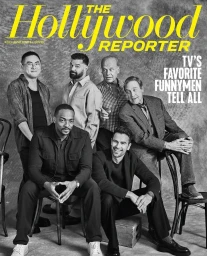 Group of six men seated and standing on chairs against a textured grey background for a magazine cover featuring make-up by Amber Amos.