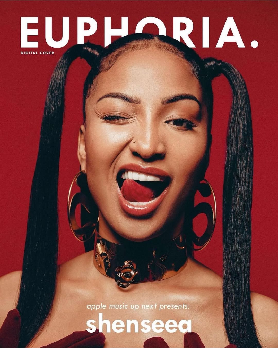 Shenseea, digital cover for Euphoria, poses winking with her tongue out. She wears hoop earrings and a gold collar against a red background.