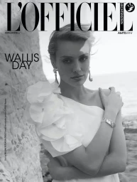 Monochrome magazine cover portrait of Wallis Day wearing an asymmetric white dress with ruffled shoulder detail