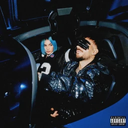 Man and woman with blue hair sitting inside a dark car interior under moody blue lighting, styled by Celia Arias.