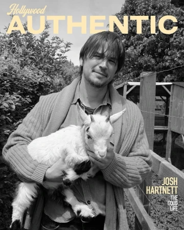 Black and white portrait of Josh Hartnett holding a small white goat, with the words 'Hollywood Authentic' visible at the top.