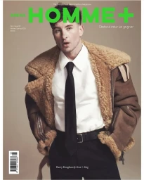 Magazine cover featuring Barry Keoghan wearing a shearling jacket, white shirt, and black tie against a neutral background.