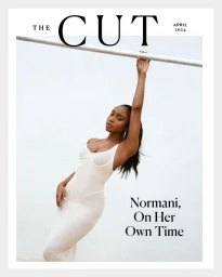 Normani holding a white rail in a textured cream dress for The Cut magazine cover editorial