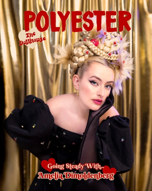Magazine cover featuring Amelia Dimoldenberg with braided blonde hair, jewelry, and a black dress, set against a golden background.