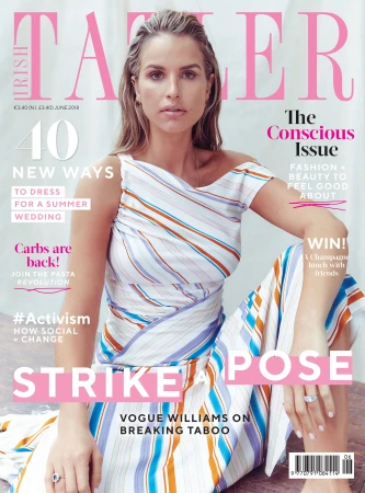 Magazine cover featuring Vogue Williams wearing a striped outfit, seated against a soft pink backdrop with magazine text and headlines.