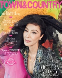 Michelle Yeoh wearing a dramatic black tulle hat and sequined jacket styled by Cristina Ehrlich on a magazine cover