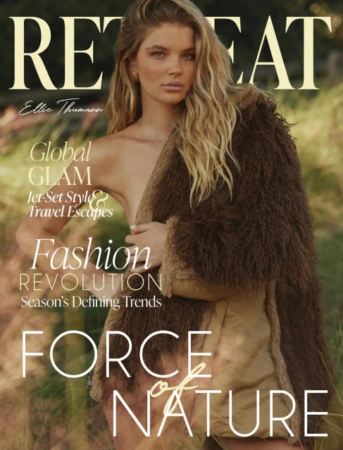 Magazine cover featuring a young adult woman with long wavy blonde hair wearing a brown fur coat in an outdoor, grassy setting.