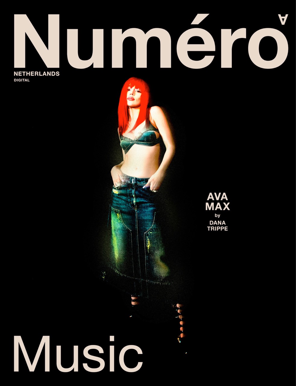 Magazine cover featuring Ava Max in a bra top and maxi skirt, with red hair, against a black background, promoting a music issue.