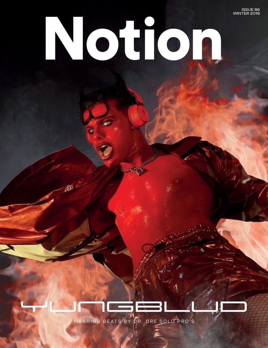 Magazine cover featuring Yungblud, with red skin, small devil horns, and red headphones, against a fiery background with Notion logo.