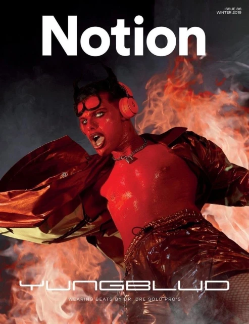 Magazine cover featuring Yungblud, with red skin, small devil horns, and red headphones, against a fiery background with Notion logo.