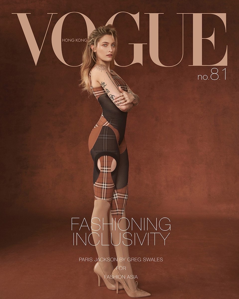 Vogue Hong Kong cover featuring Paris Jackson in a bodysuit and heels, posing in front of a brown backdrop with magazine text overlay.