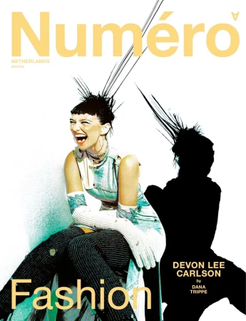 Fashion magazine cover features a smiling model with an updo and edgy style, next to a shadow, promoting the magazine's fashion content.