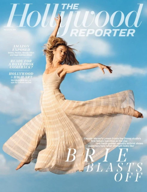 The Hollywood Reporter magazine cover featuring Brie Larson in a flowing dress, arms outstretched against a light blue sky with clouds.