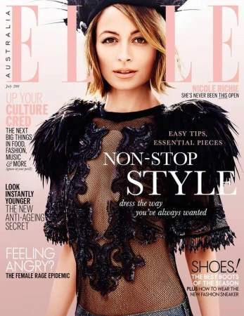 Nicole Richie wearing a black feathered lace top and dark cap for an Elle Australia magazine cover.