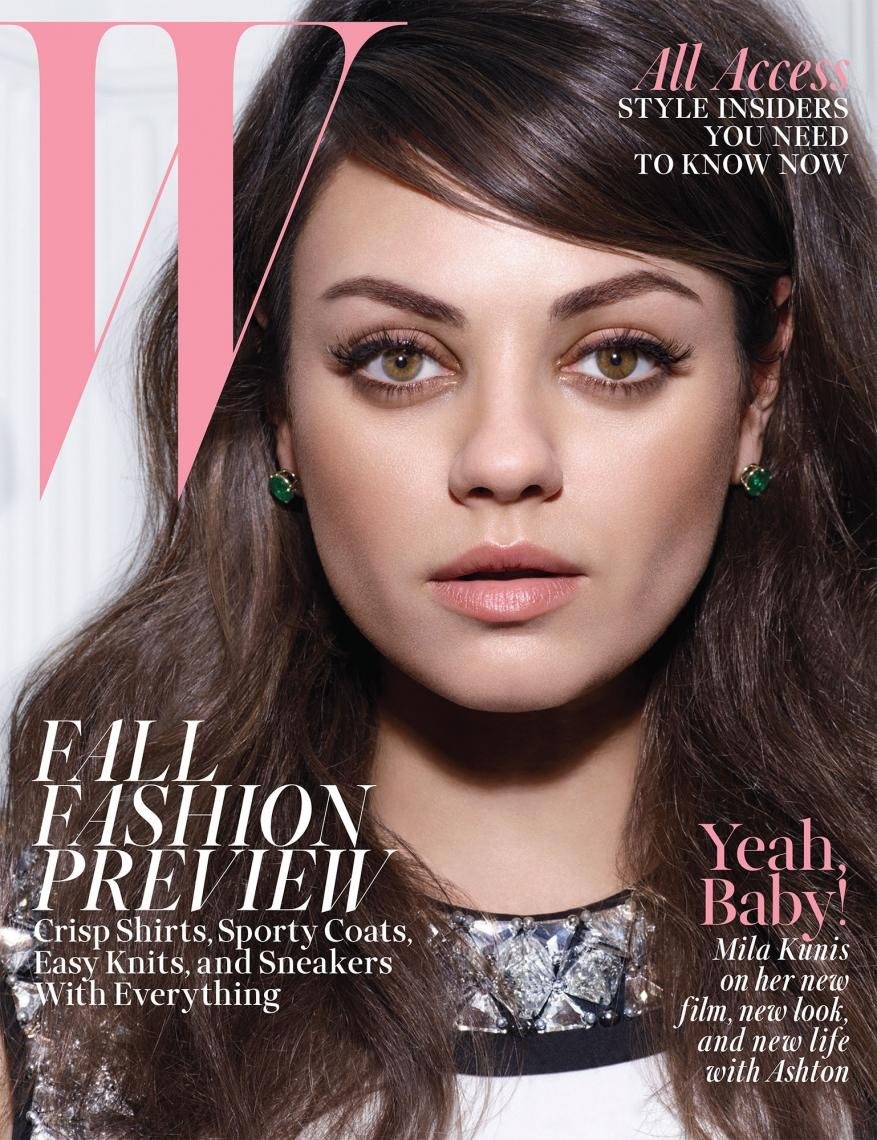 Close-up portrait of Mila Kunis with dark brown hair and green earrings featured on magazine cover