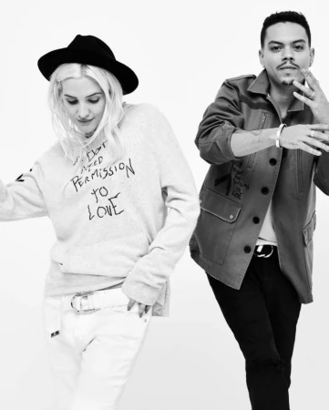 Monochrome portrait of two models posing against a white background, featuring hair styling by Denis De Souza in Los Angeles.