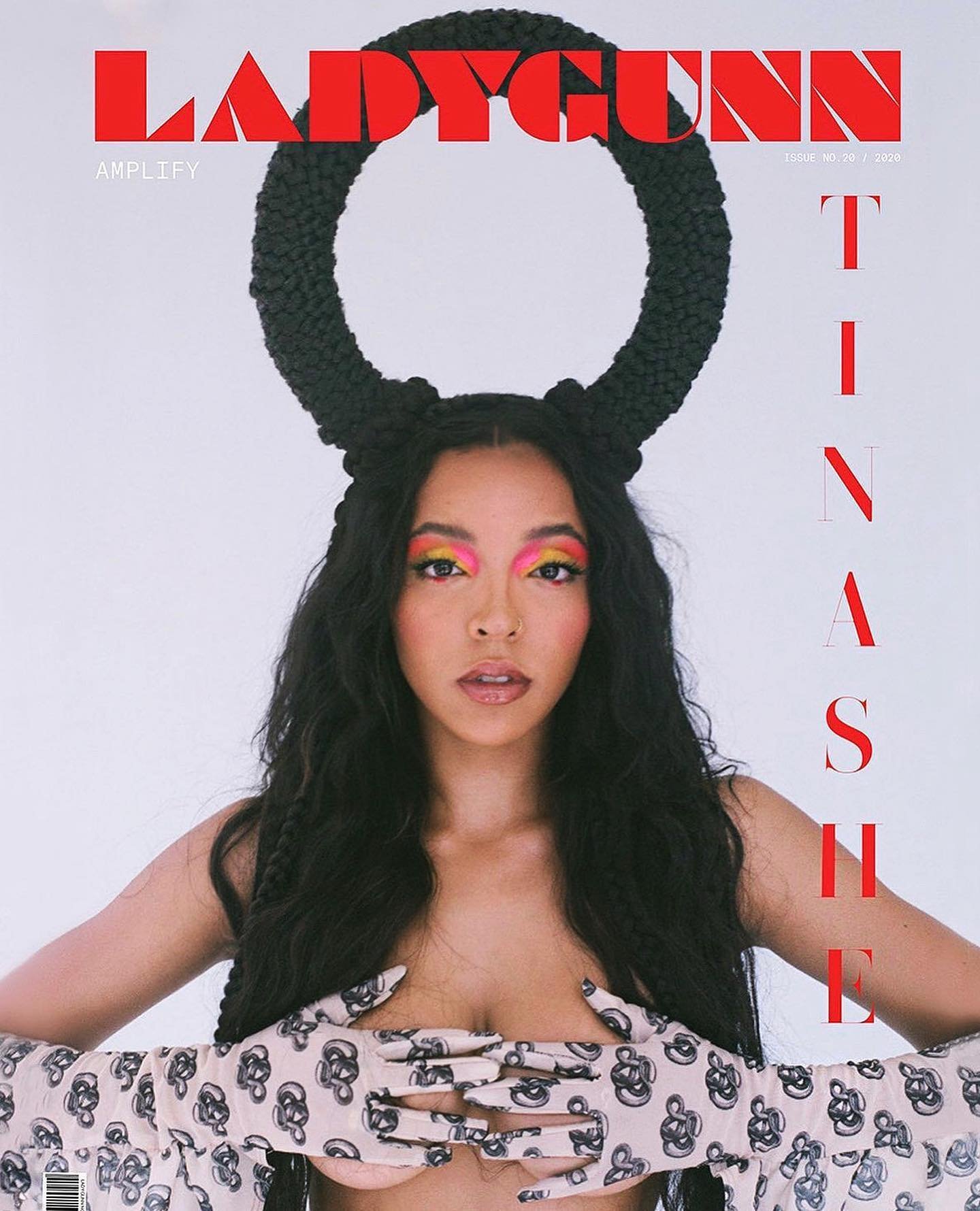 LadyGunn magazine cover featuring a female model with colorful eyeshadow, dark braided hair, and floral print gloves, on a white backdrop.
