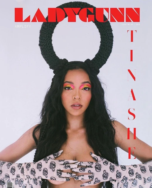 LadyGunn magazine cover featuring a female model with colorful eyeshadow, dark braided hair, and floral print gloves, on a white backdrop.