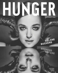 Close-up monochrome portrait of actress Celine Buckens with a symmetrical mirror reflection below against a grey background.